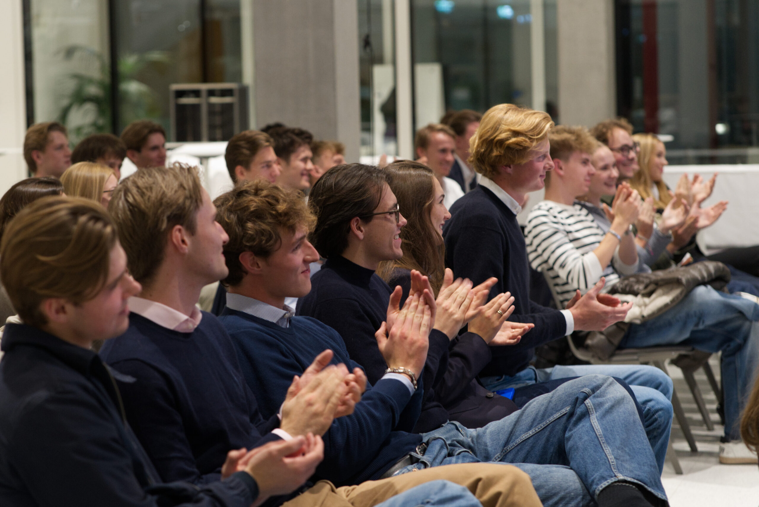 Students applauding during the speaker event
